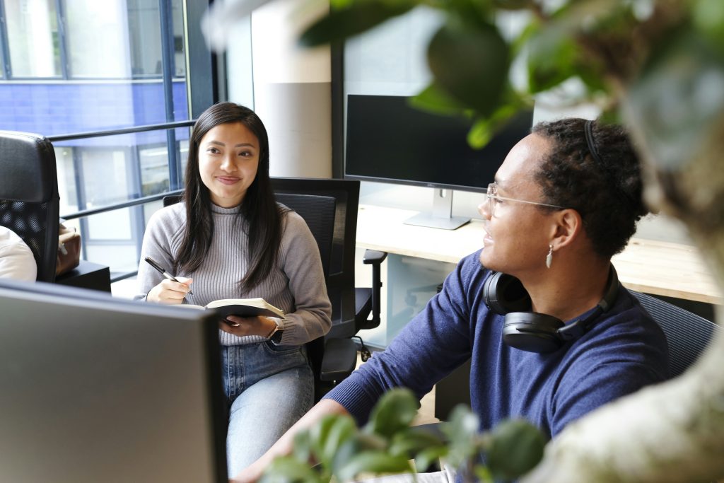 How Knowledge Management Software Is Revolutionizing Business Team members collaborating and sharing knowledge using knowledge management software to enhance productivity and communication