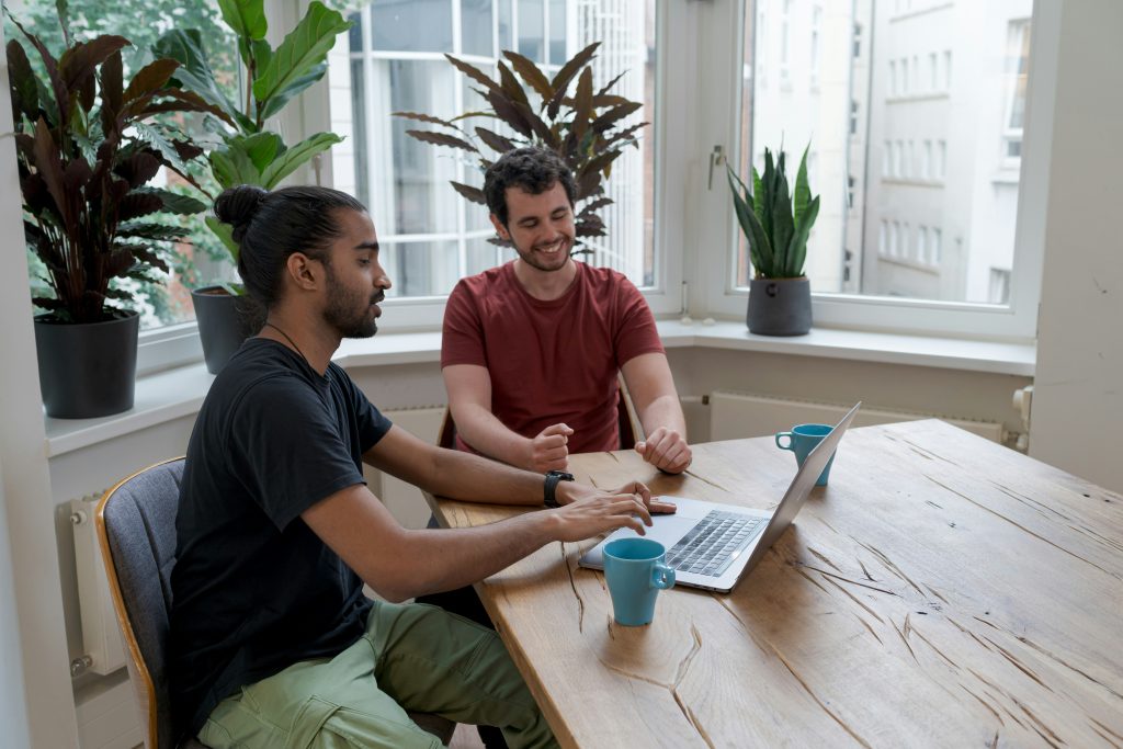 How Knowledge Management Software Is Revolutionizing Business Two professionals analyzing data and uncovering valuable business insights using knowledge management software