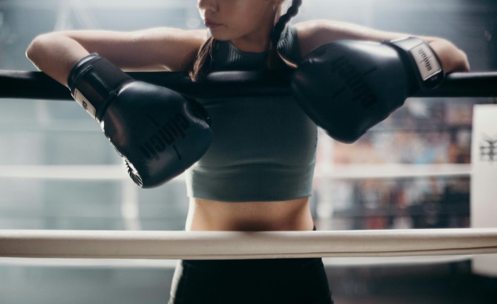 A masculine woman depicted as a strong female with boxing gloves